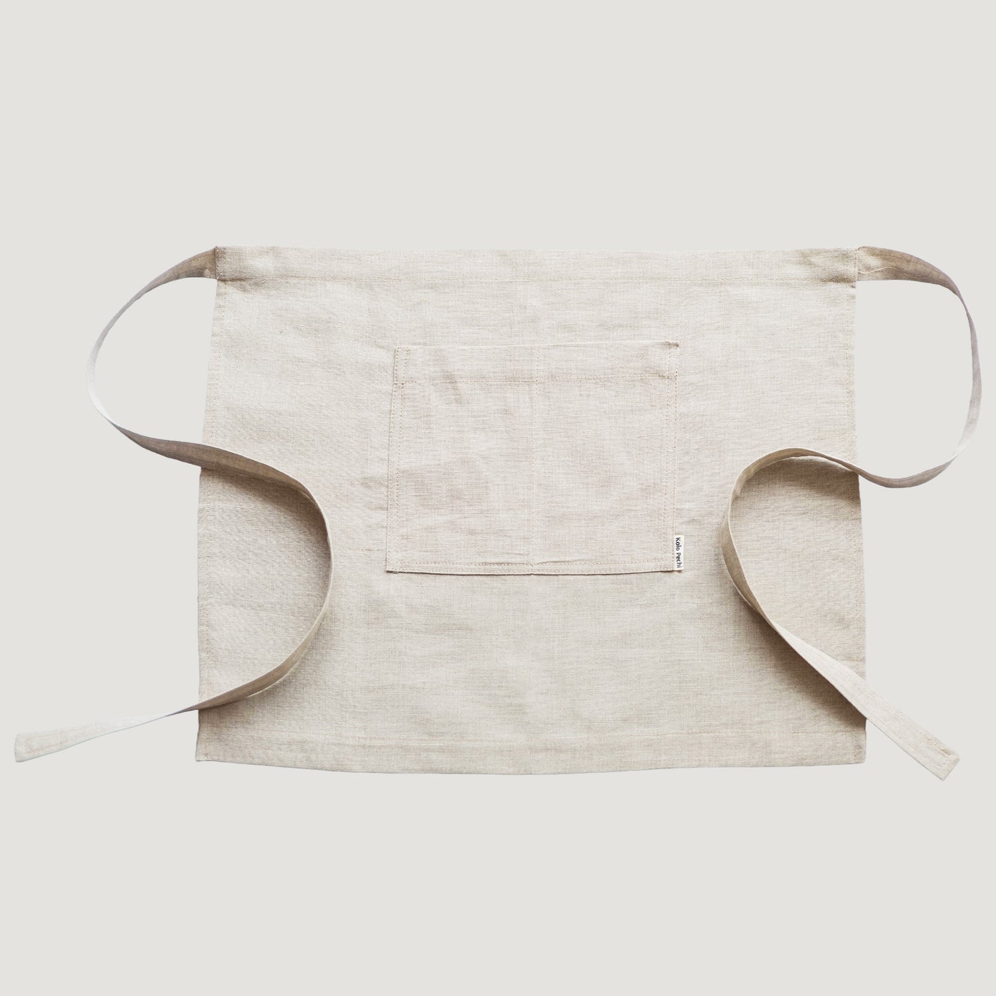 Close-up of natural linen fabric texture — Polissia waist apron by Kolo Pechi