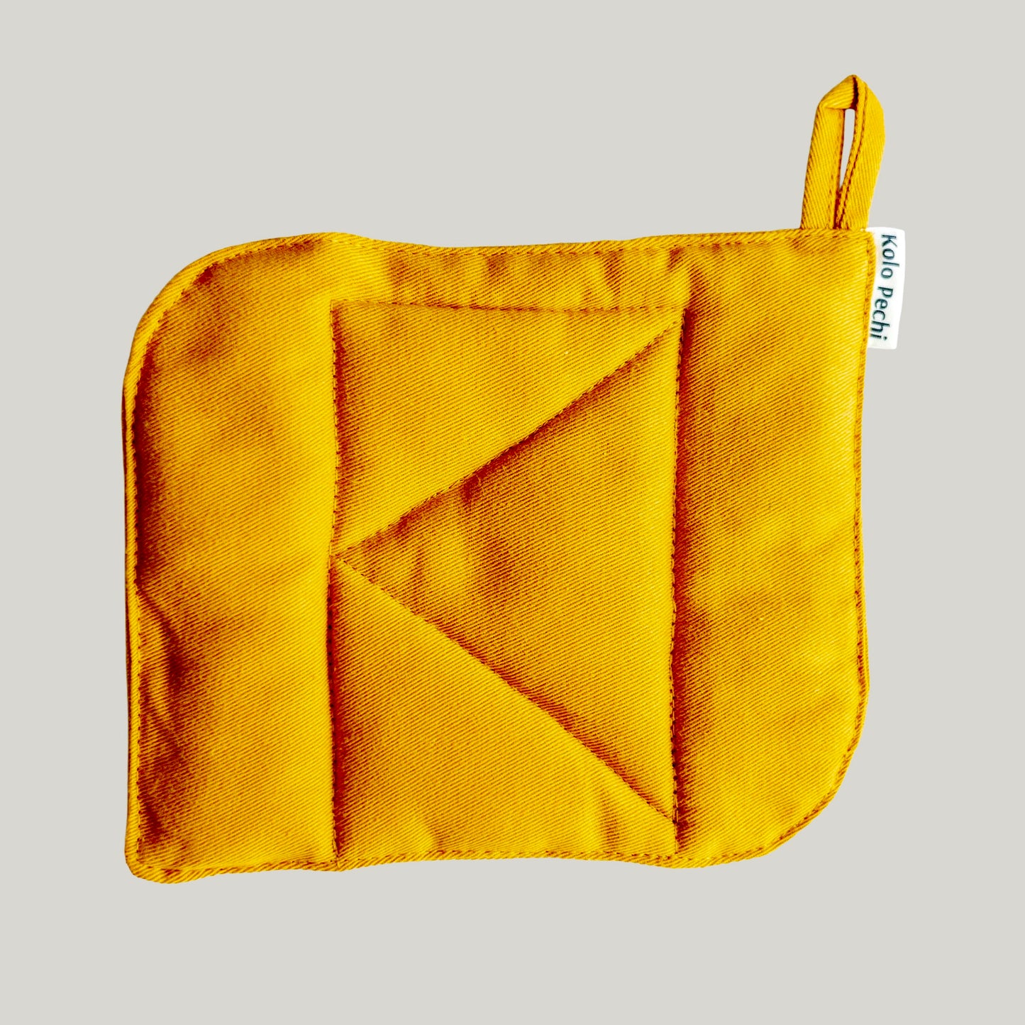 Sunset Pot Holder — geometric quilted detail with hanging loop, natural cotton, handcrafted in Ukraine