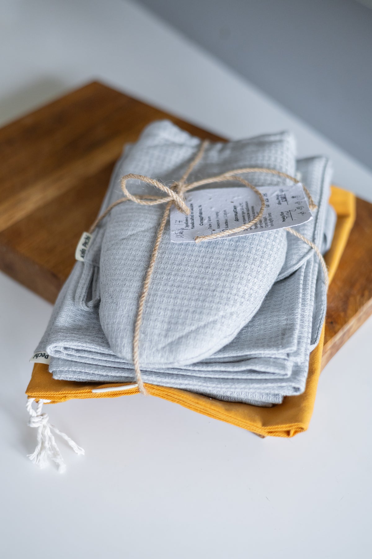 The folded Kolo Pechi kitchen textiles set from the cotton Lviv Sky collection. 