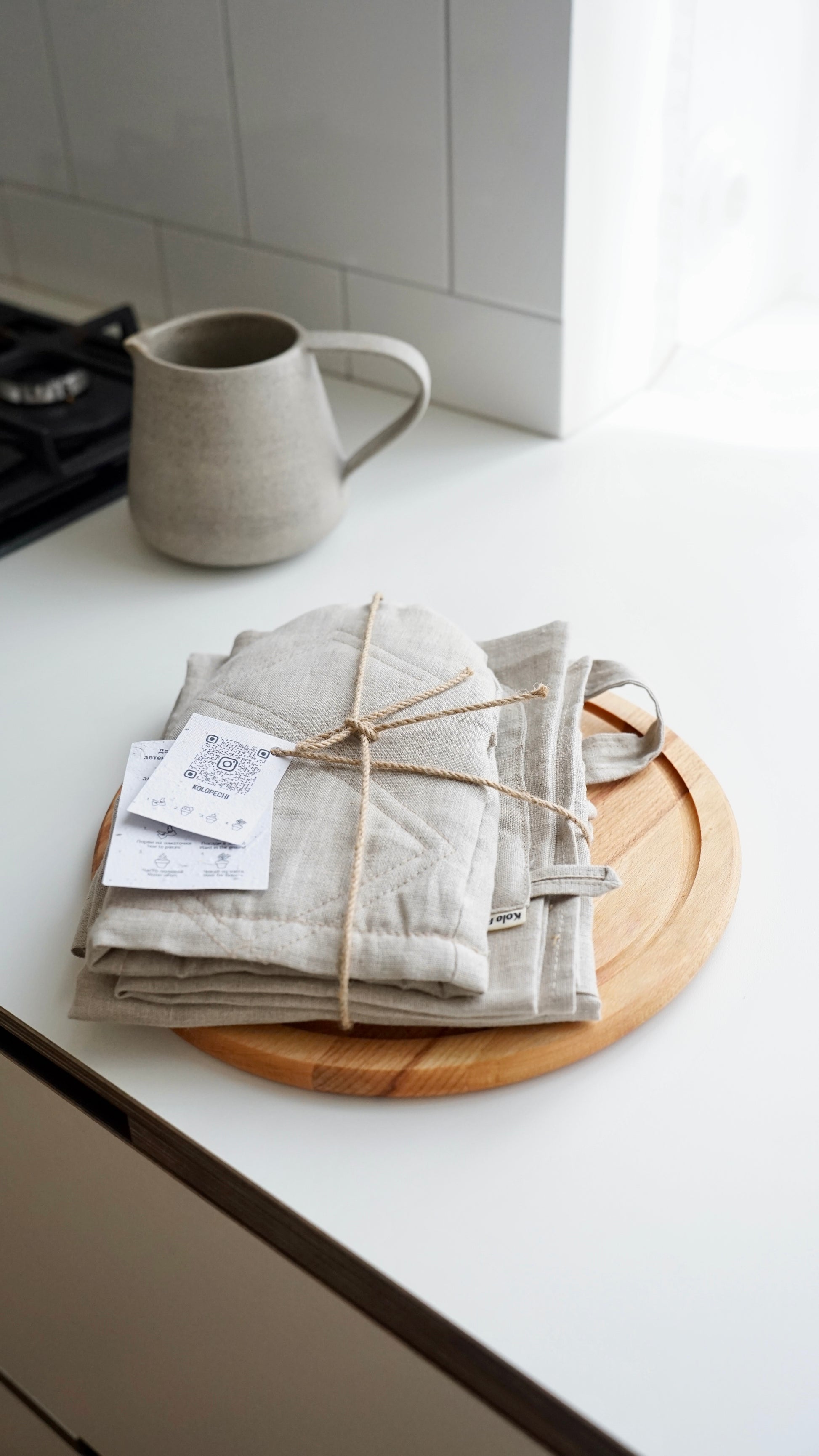 Natural linen kitchen set on wooden surface — Polissia collection by Kolo Pechi